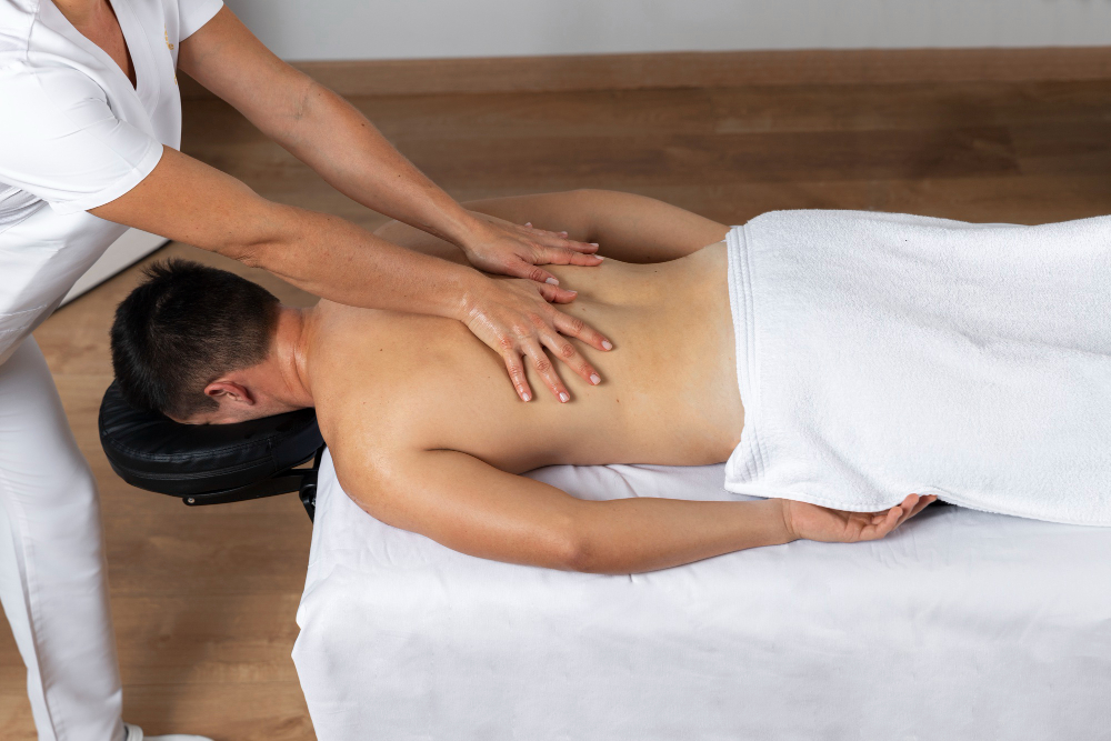 therapist applying thai massage